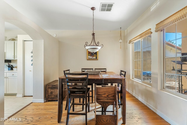 dining area with light wood-type flooring