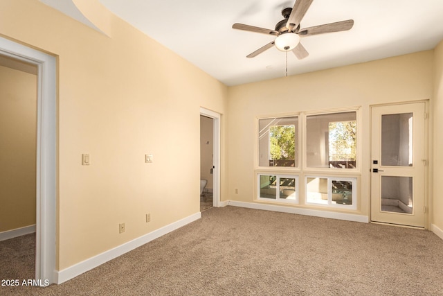 unfurnished room with carpet floors and ceiling fan