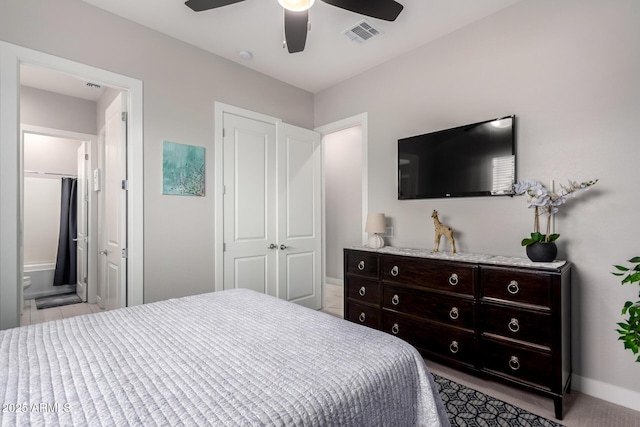 bedroom with baseboards, visible vents, and a ceiling fan