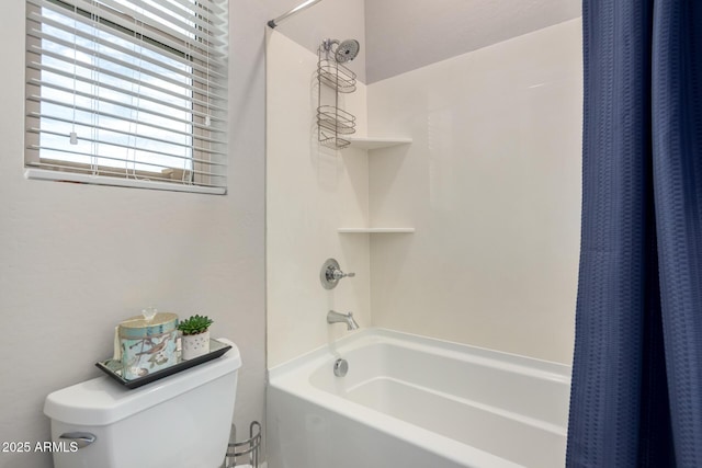 bathroom featuring toilet and shower / tub combo with curtain