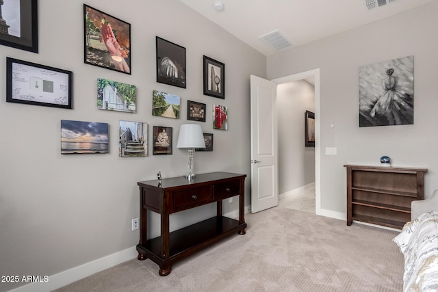 carpeted bedroom with visible vents and baseboards