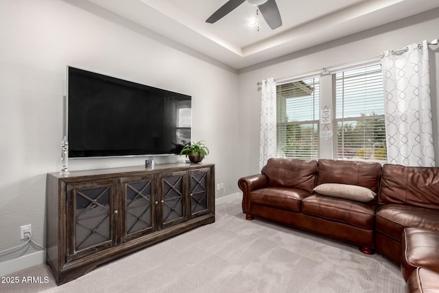 living room with ceiling fan, recessed lighting, carpet floors, baseboards, and a raised ceiling