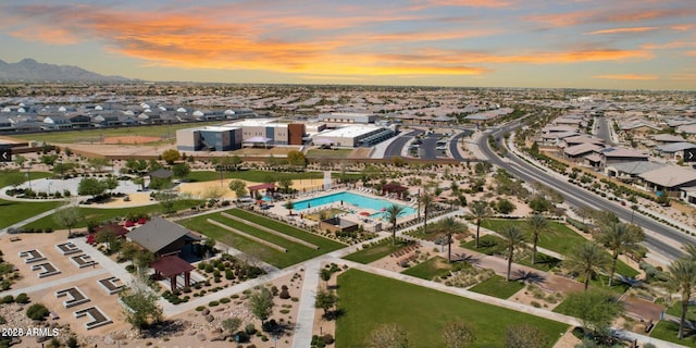 aerial view at dusk featuring a residential view