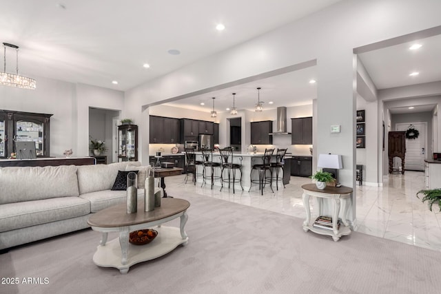 living room featuring marble finish floor and recessed lighting