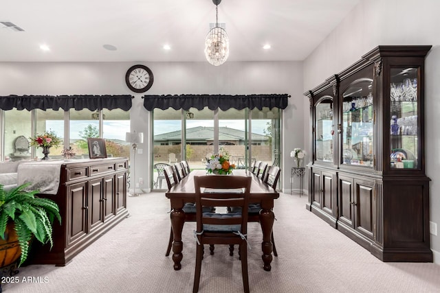 dining room with light colored carpet, recessed lighting, visible vents, baseboards, and an inviting chandelier