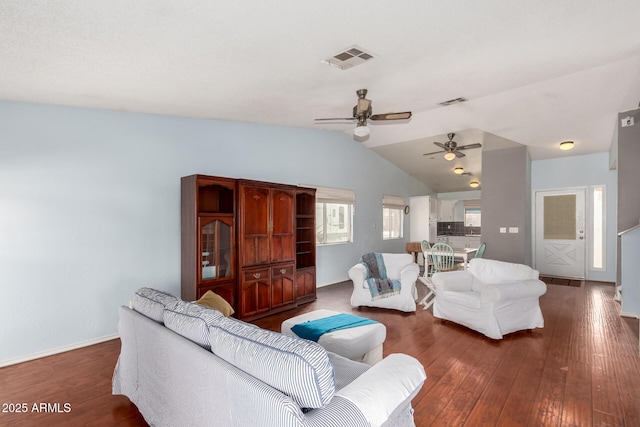 living room with ceiling fan, dark hardwood / wood-style flooring, and lofted ceiling