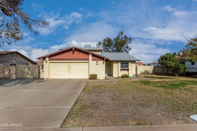 view of front facade with a garage and a front yard