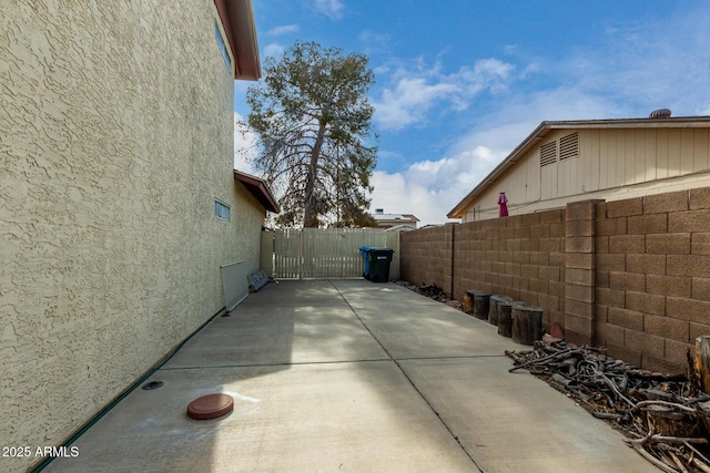 view of side of property with a patio