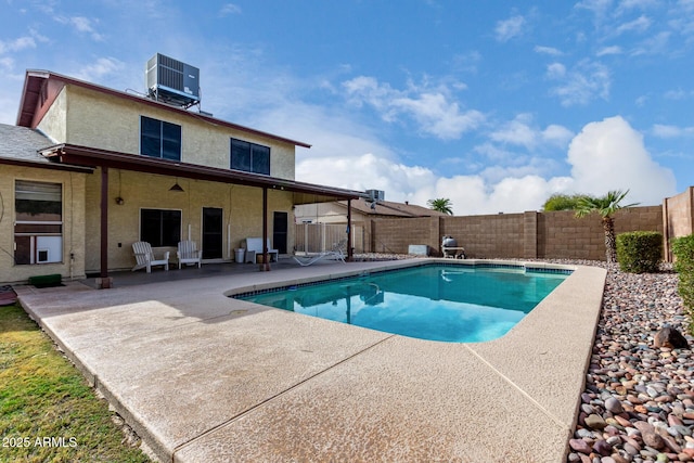 view of swimming pool featuring central AC and a patio area