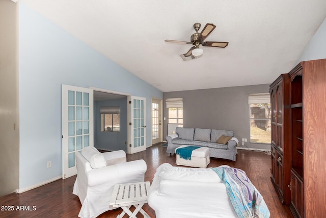 living room featuring ceiling fan, dark hardwood / wood-style flooring, and vaulted ceiling