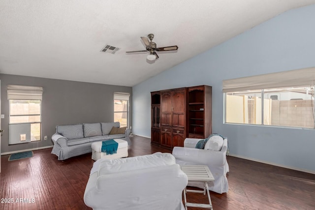 living room with ceiling fan, dark hardwood / wood-style floors, and lofted ceiling