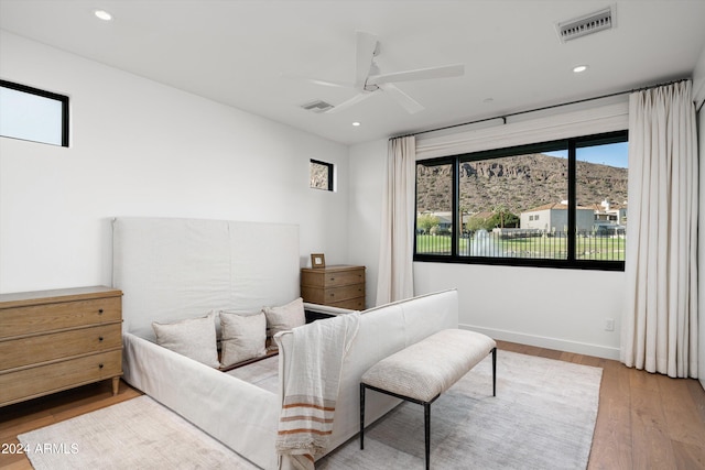 bedroom featuring ceiling fan and light hardwood / wood-style floors