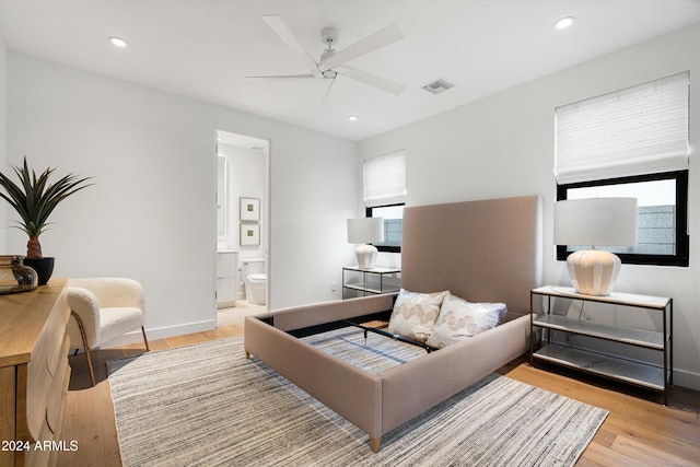 living room featuring ceiling fan and light hardwood / wood-style flooring