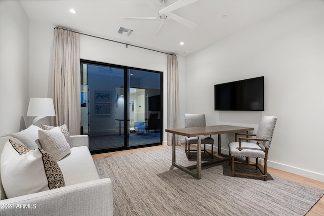 home office featuring light hardwood / wood-style flooring and ceiling fan