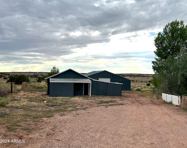 view of outdoor structure featuring a rural view