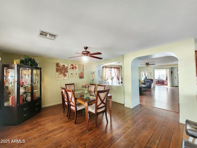 dining room featuring dark hardwood / wood-style floors and ceiling fan