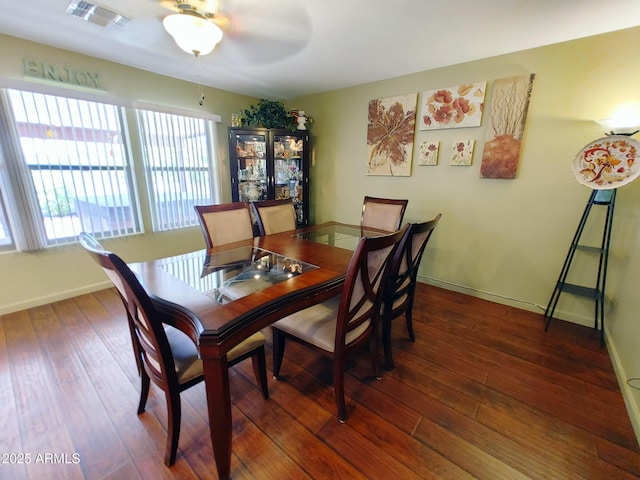 dining room featuring ceiling fan and dark hardwood / wood-style floors