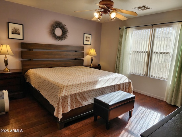 bedroom featuring dark wood-type flooring and ceiling fan