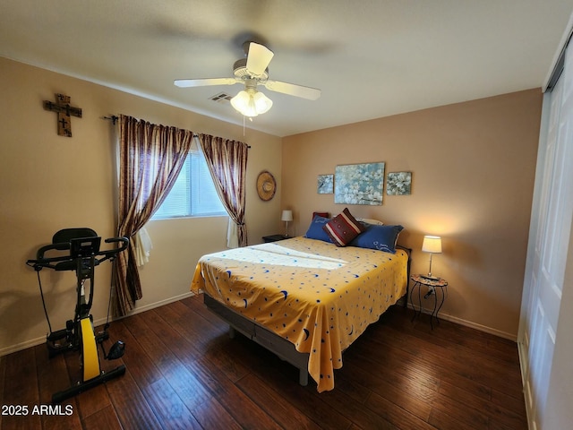 bedroom featuring dark hardwood / wood-style flooring and ceiling fan