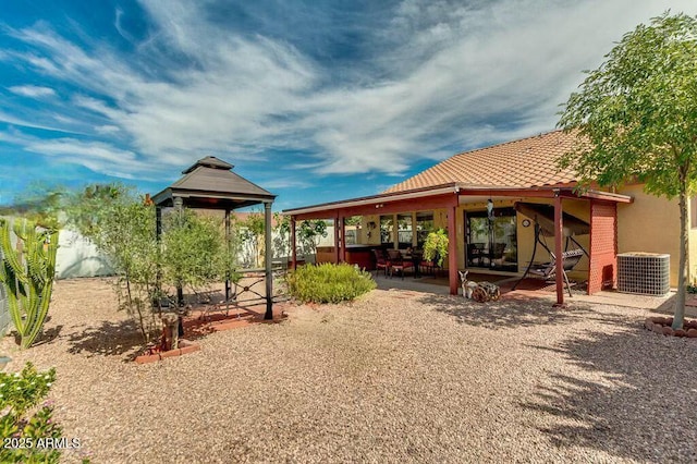 view of yard with central AC unit and a patio area