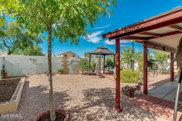 view of yard with a gazebo and a patio area