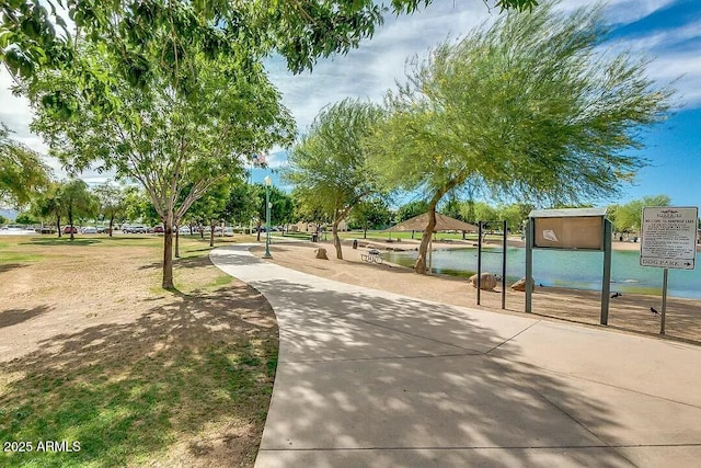 surrounding community featuring a water view