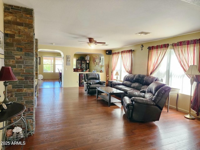 living room with wood-type flooring and ceiling fan