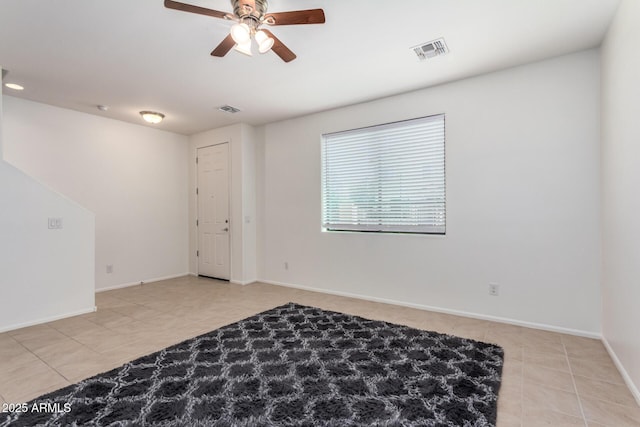 1950 N Center St Unit 115, Mesa, AZ 85201 - tiled spare room featuring a ceiling fan and baseboards