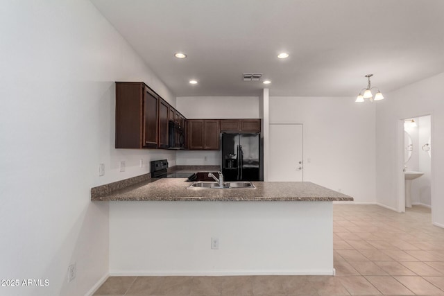 1950 N Center St Unit 115, Mesa, AZ 85201 - kitchen with black appliances, a sink, a peninsula, dark brown cabinetry, and recessed lighting