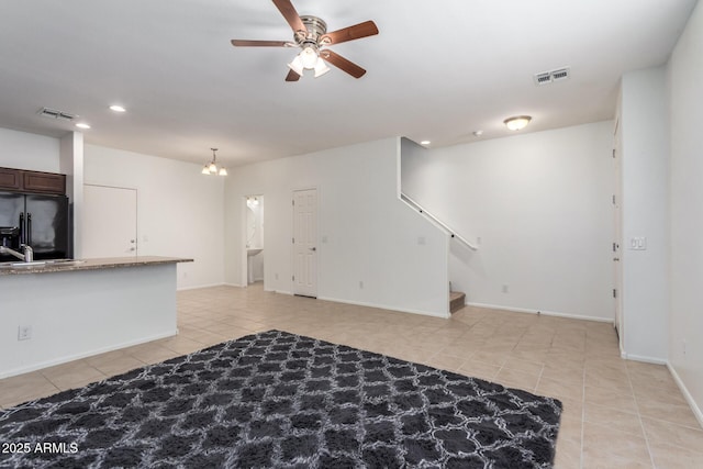 1950 N Center St Unit 115, Mesa, AZ 85201 - unfurnished living room with light tile patterned flooring, recessed lighting, a ceiling fan, stairs, and baseboards