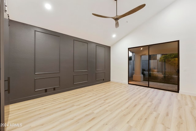 unfurnished bedroom with high vaulted ceiling, light hardwood / wood-style flooring, and ceiling fan