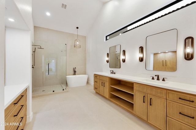 bathroom with separate shower and tub, tile patterned floors, vanity, and lofted ceiling