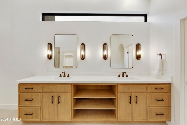 bathroom with tile patterned flooring and vanity