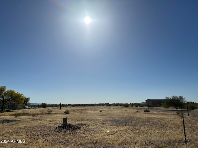 view of yard with a rural view