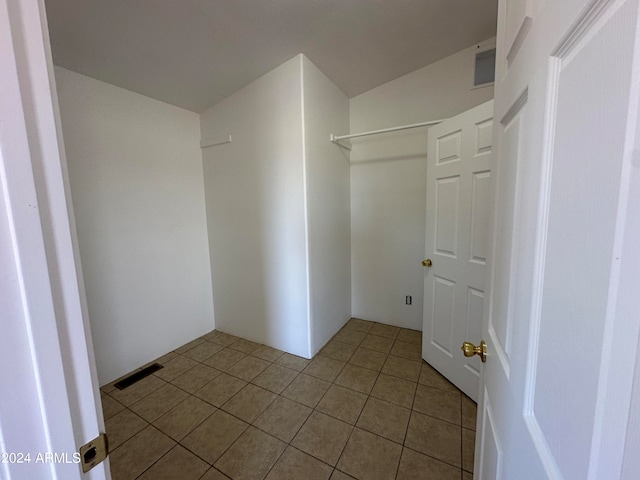 spacious closet featuring light tile flooring