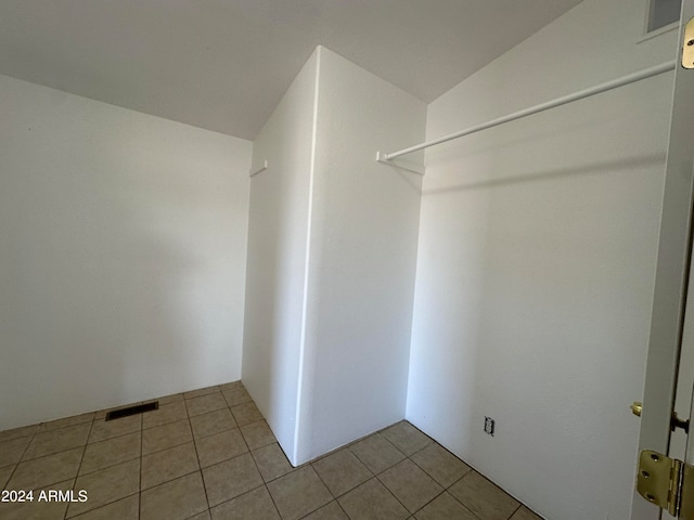 spacious closet featuring tile flooring
