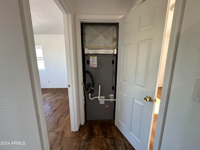 hallway with dark hardwood / wood-style floors