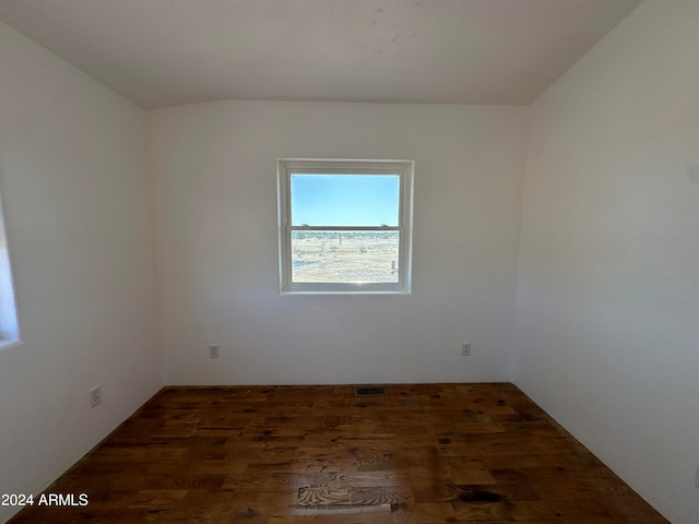 empty room featuring dark wood-type flooring