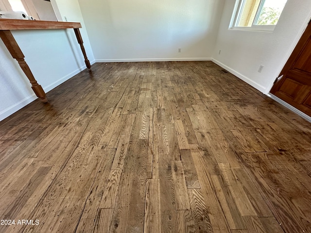 unfurnished bedroom with hardwood / wood-style flooring