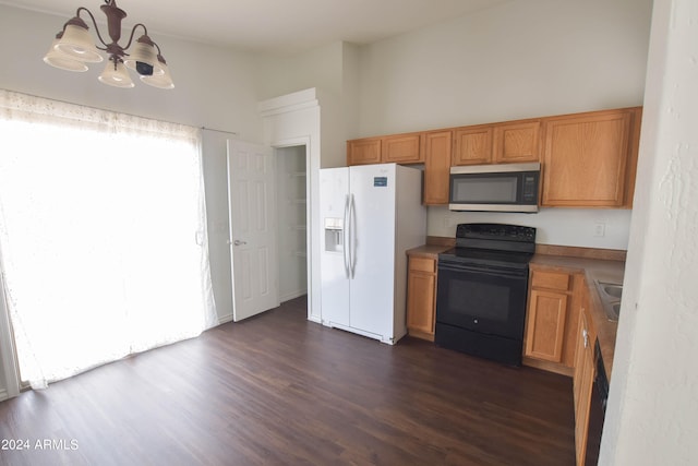 kitchen with an inviting chandelier, white fridge with ice dispenser, dark hardwood / wood-style flooring, and black range with electric stovetop