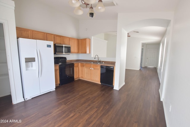 kitchen featuring sink, dark hardwood / wood-style flooring, and black appliances