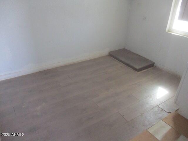 empty room with light wood-type flooring