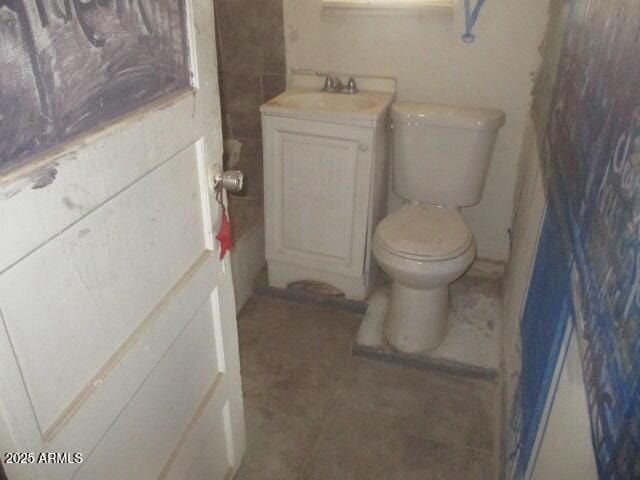 bathroom featuring vanity and toilet