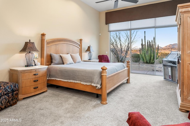 bedroom with ceiling fan, access to outside, and light carpet