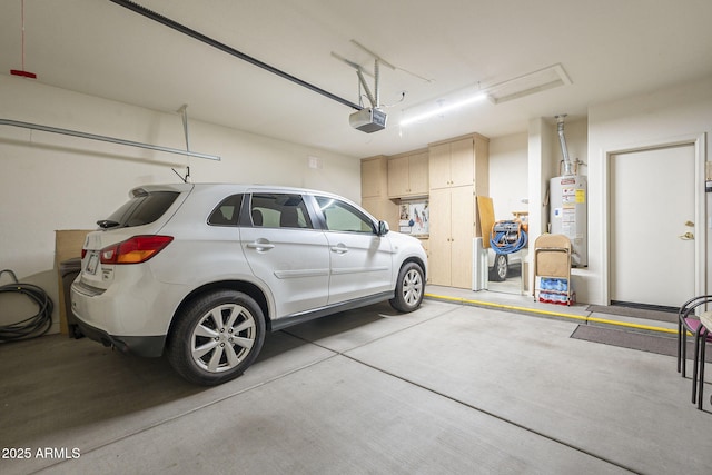 garage with gas water heater and a garage door opener