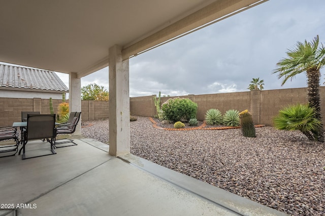 view of patio / terrace with outdoor dining space and a fenced backyard