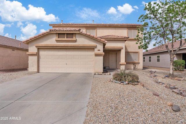 mediterranean / spanish-style home featuring stucco siding, an attached garage, driveway, and a tile roof