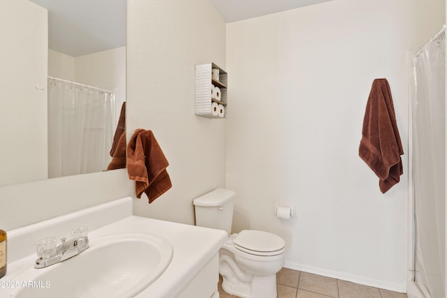 bathroom with vanity, baseboards, curtained shower, tile patterned floors, and toilet