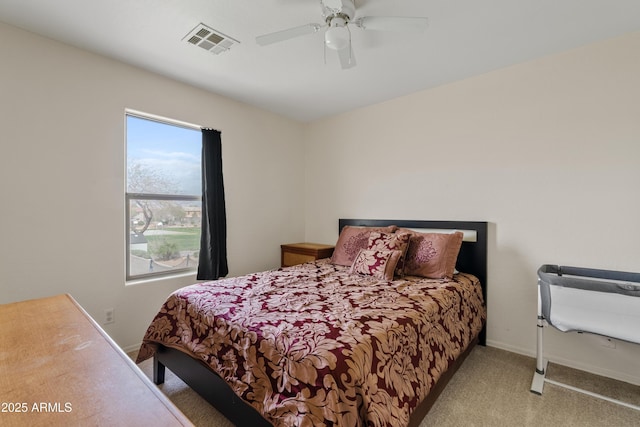 carpeted bedroom with a ceiling fan, baseboards, and visible vents