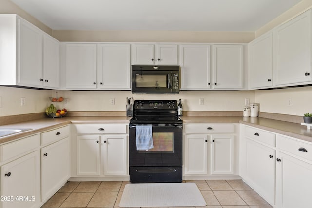 kitchen featuring black appliances, white cabinets, and light tile patterned floors